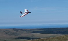 RC airplane aove hills